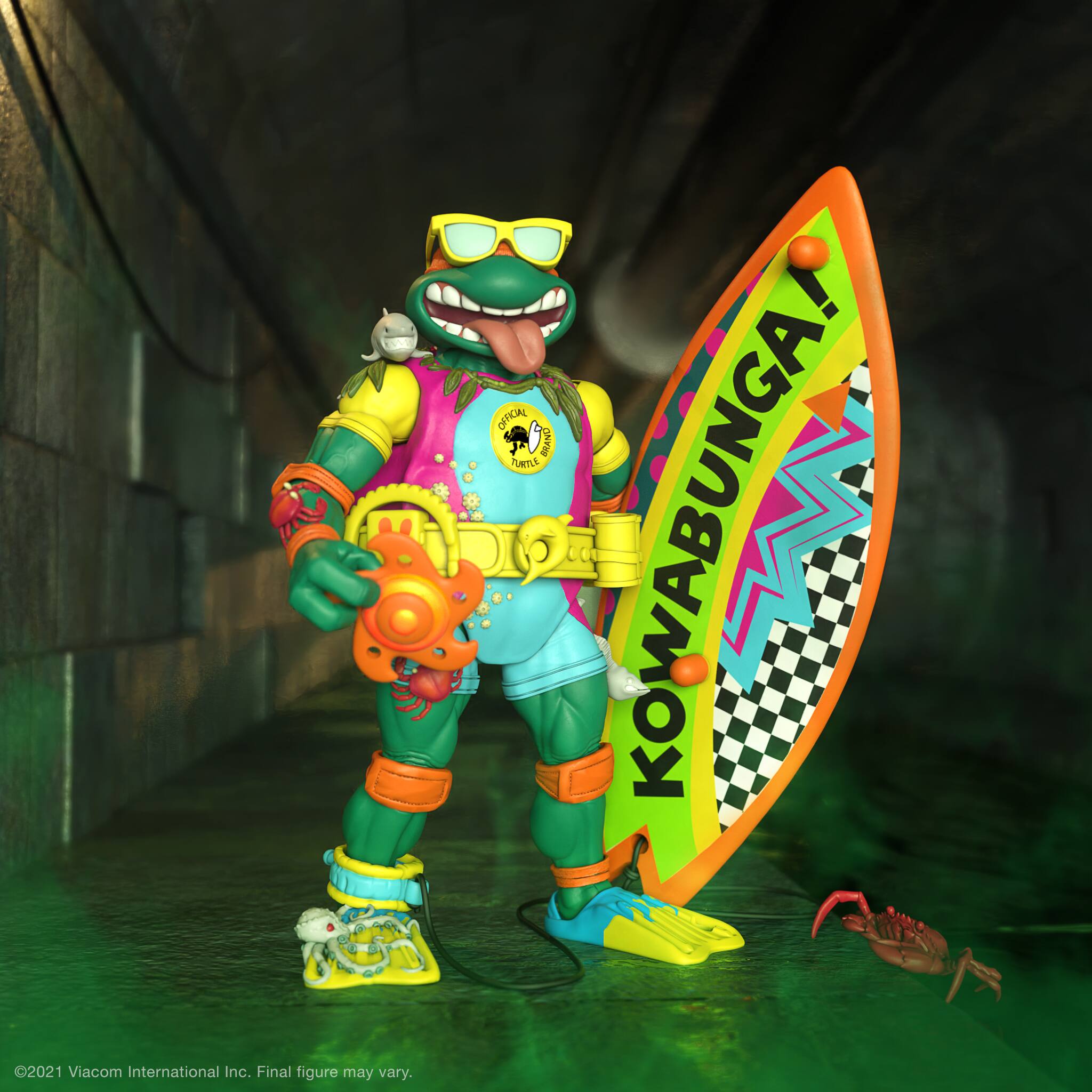 The image features a colorful action figure holding a surfboard and wearing a Hawaiian shirt. The figure is posed in a fun and playful manner, likely representing a character from a popular franchise. The surfboard is prominently displayed, adding to the overall vibrant and lively atmosphere of the scene. The action figure is a representation of a popular character, and its unique design and accessories make it an appealing collectible item for fans of the franchise.