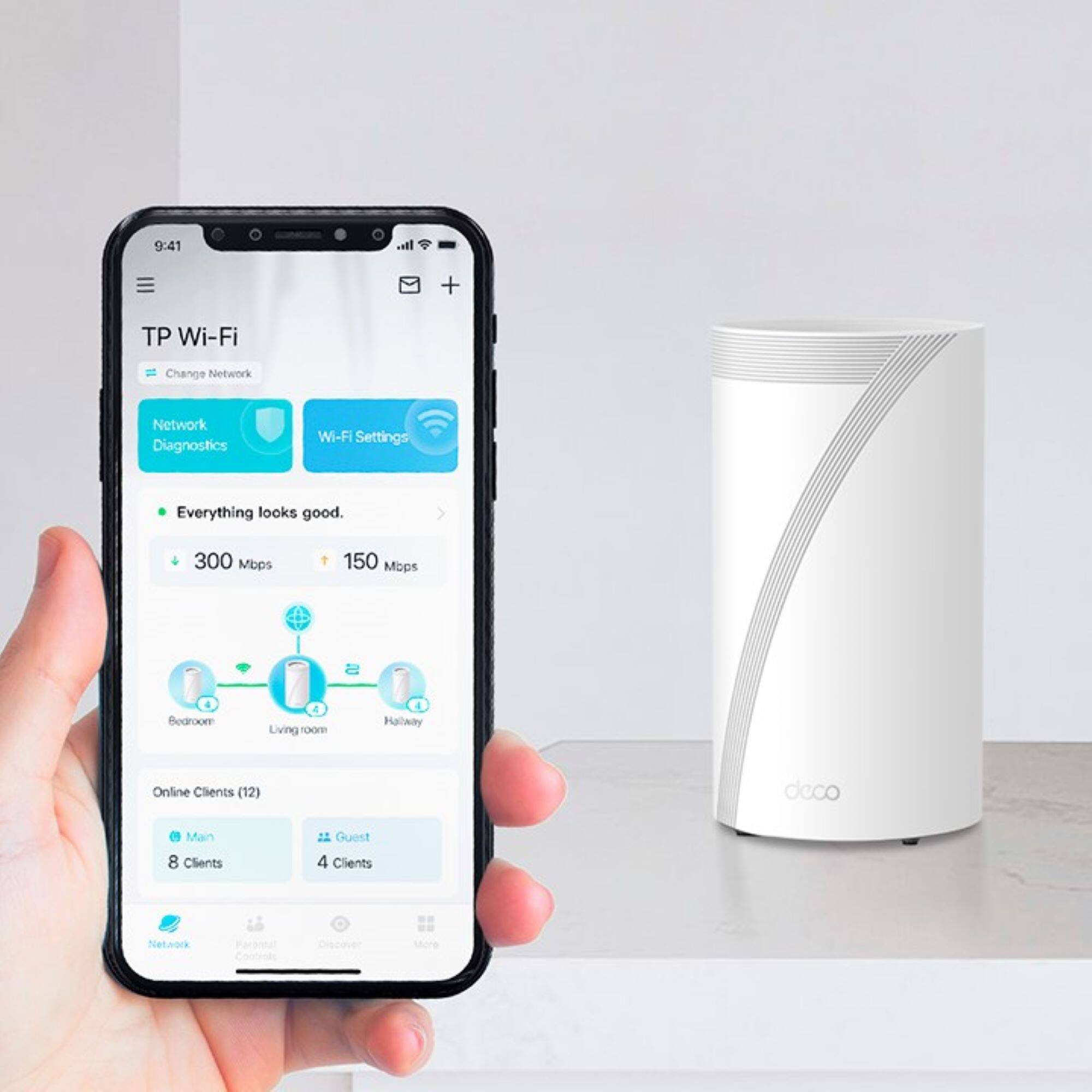 The text on the image reads: "9:41 Its. + TP Wi-Fi Change Network Network Diagnostics Wi-Fi Settings Everything looks good. 300 Mbps 150 Mops Bedroom 4 Living 1oom Halway Online Clients (12) deco Main 8 Clients Guest 4 Clients Netwock Discover shore."