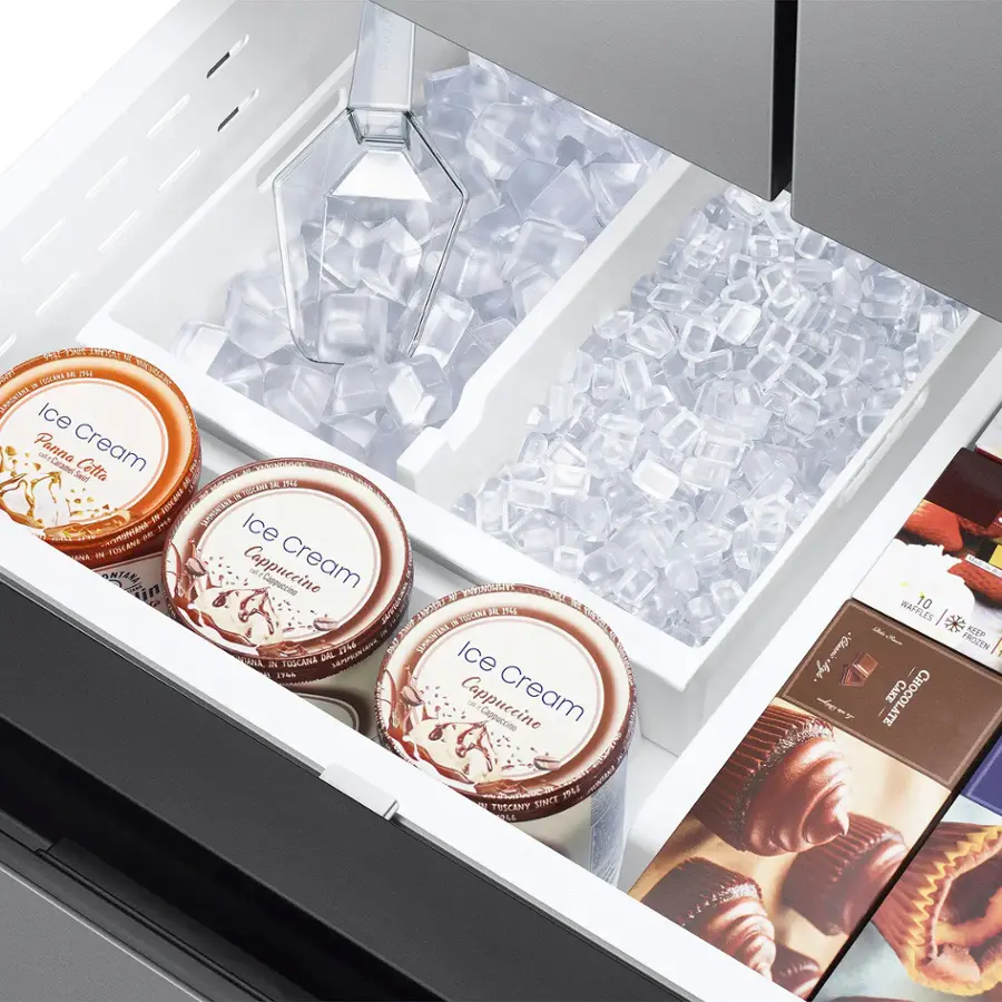 The image shows a drawer filled with various ice cream flavors and chocolate candies. There are four different types of ice cream, each with distinct flavors, and a few chocolate candies placed in the drawer. The drawer is organized to showcase the variety of options available for consumption.