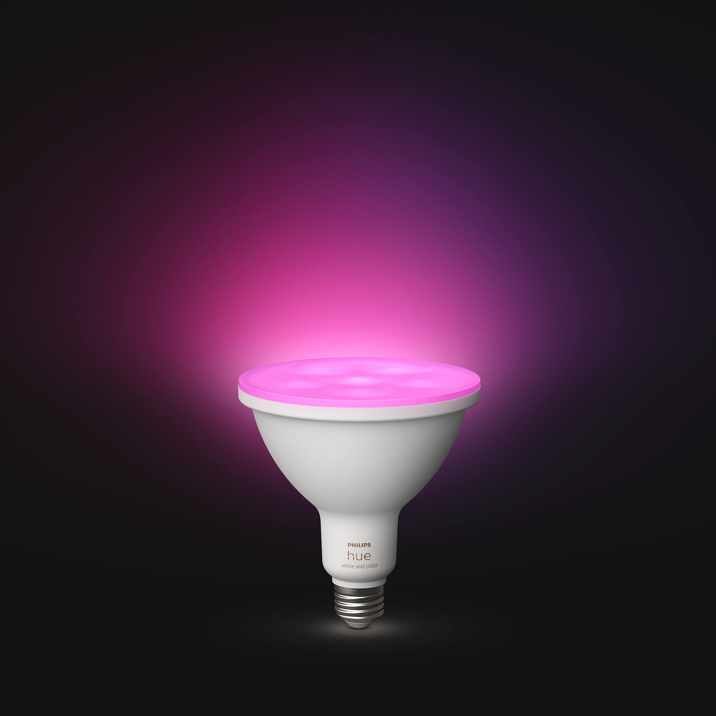 The image features a white light bulb with a pink hue, which is illuminated and placed against a dark background. The bulb is prominently displayed in the foreground, while the rest of the image is in black. The light bulb is positioned in the center of the image, and its glowing pink hue creates a visually striking contrast against the dark background.
