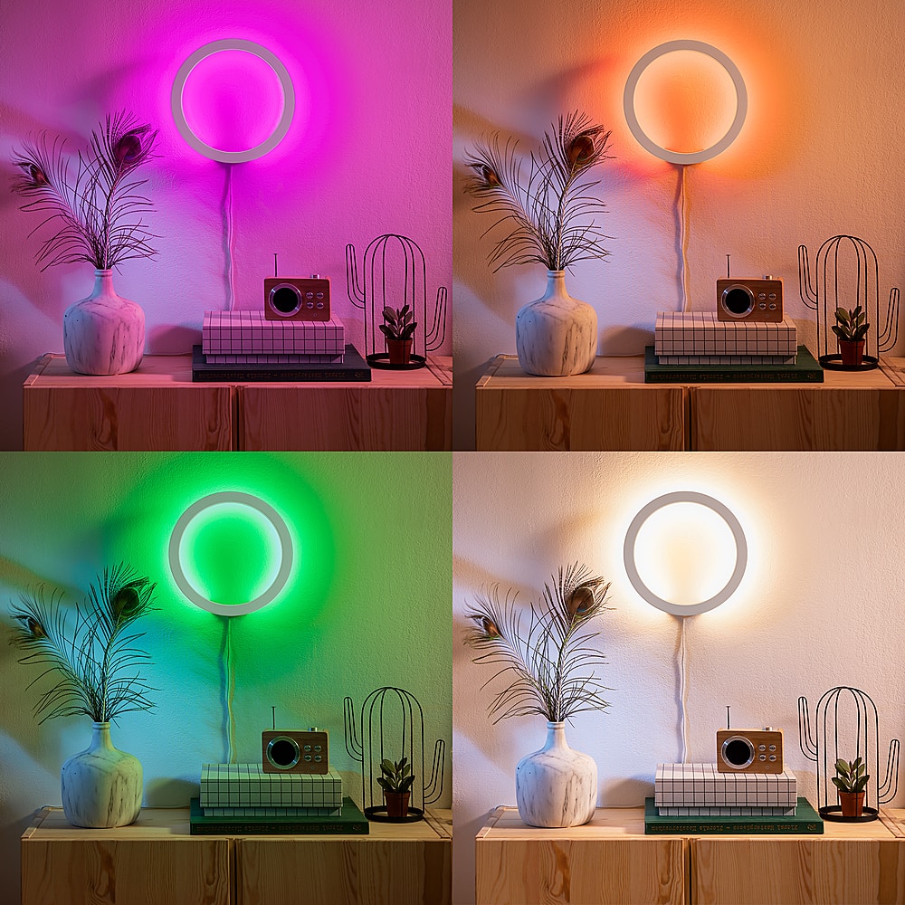 I cannot group or correct the text as it does not seem to be related to the image. The image features a table with a lamp, a potted plant, and a clock. There are also four different colored lights on the lamp.