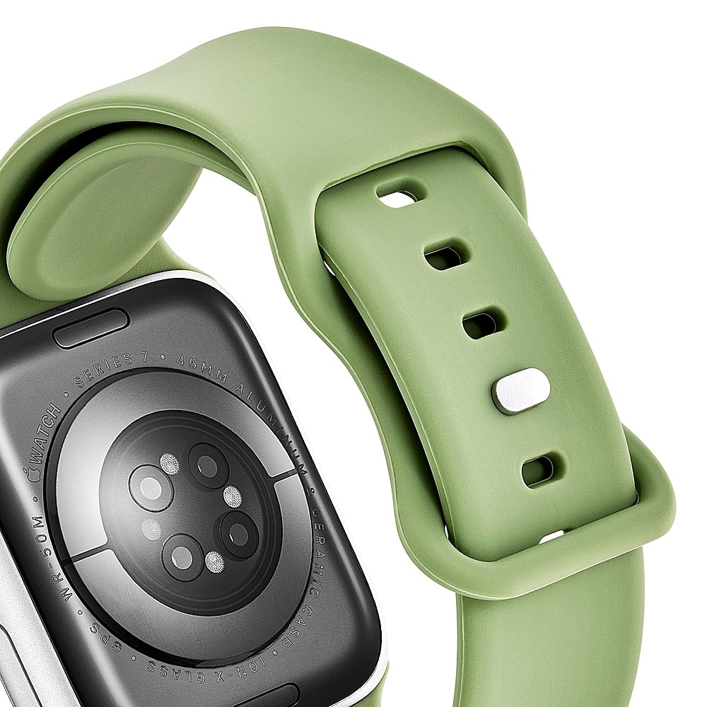 The watch is made of aluminum and has a ceramic face. It is a smart watch and is part of the Apple Watch series. The watch is green and has a black face.