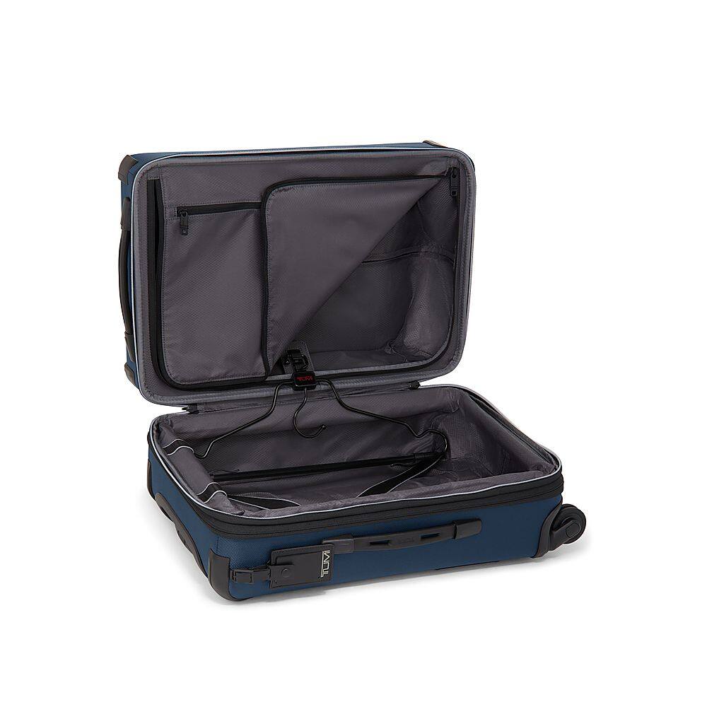 Left View: TUMI - Aerotour International 24" Expandable 4 Wheeled Spinner Suitcase - Navy