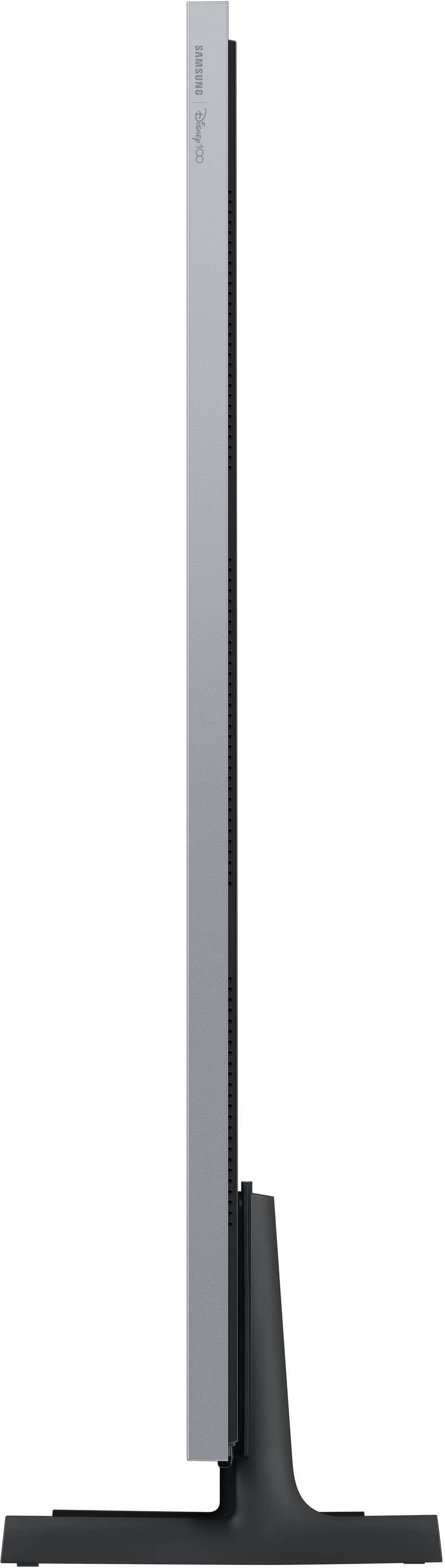 The image features a large, thin, and tall television set, which is likely a Samsung product. The television is positioned in the center of the image, with a white background surrounding it. The design of the TV appears to be sleek and modern, making it an attractive addition to any living space.