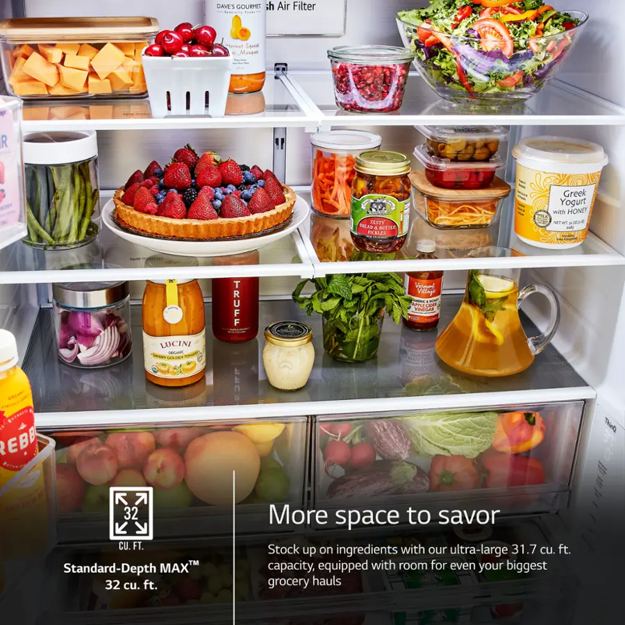 The image features a refrigerator filled with various food items, including fruits, vegetables, and other ingredients. The refrigerator is stocked with a large capacity, allowing for ample storage of groceries. The refrigerator is also equipped with a standard-depth max, which provides additional space for storing larger items. The refrigerator is filled with a variety of food items, making it a convenient and accessible place to store and prepare meals.