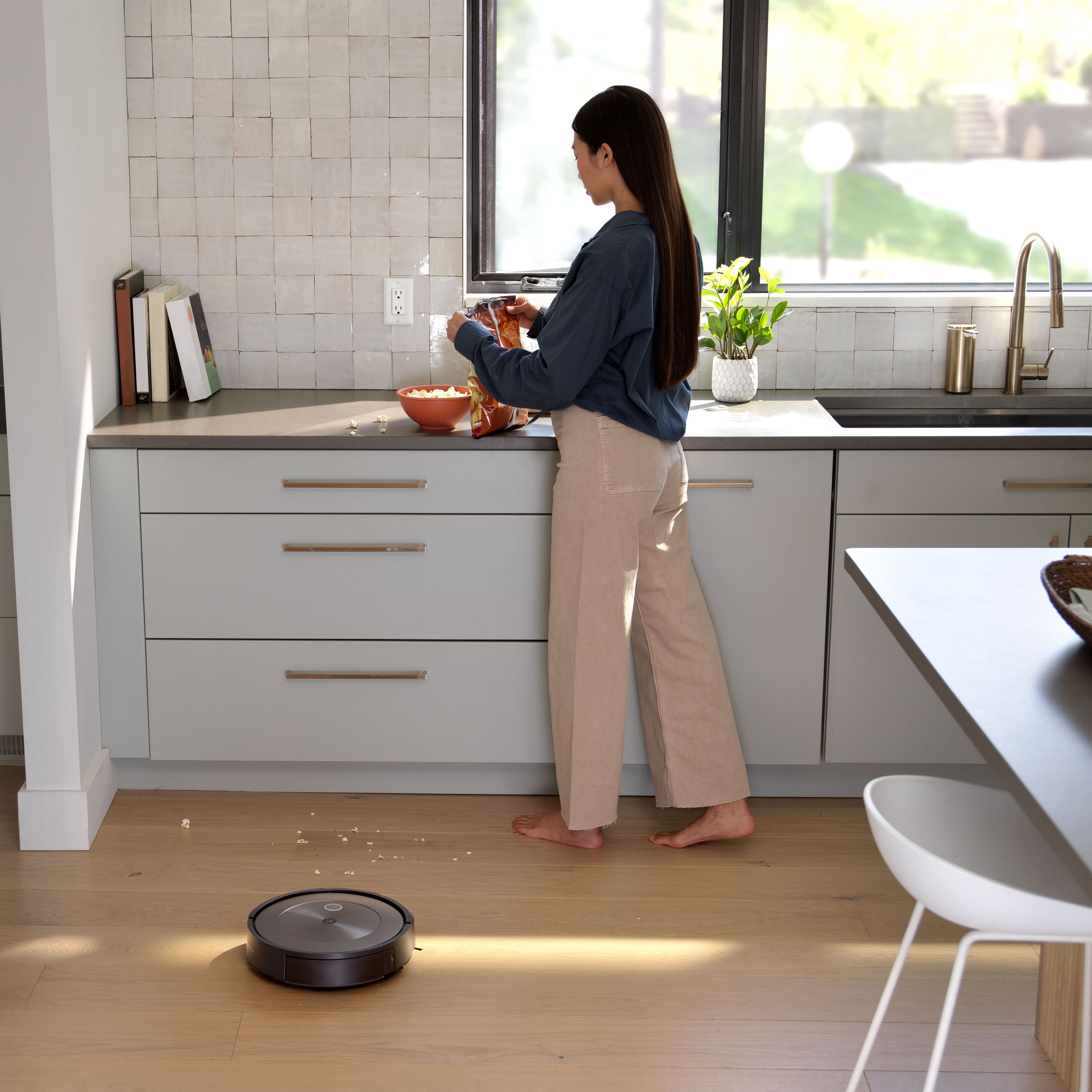 Cleans in neat rows, navigates around furniture.