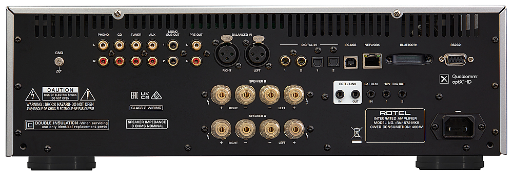 The text on the image reads: "PHONO 8 TUNER AUX MONO SUB OUT PRE OUT BALANCED IN POST USH L L DIGITAL IN PC-USB NETWORK BLUETOOTH sEEOR GND R 2 A CAUTION RISK OF ELECTRIC SHOCK DO NOT OPEN WARNING SHOCK HAZARD-DO NOT OPEN AVIS-RISQUE DE DE CHOC ELECTRIQUE-NE PAS OUVRR DOUBLE INSULATION When servicing use only identical replacement parts UK CA CLASS 2 WIRING SPEAKER IMPEDANCE 0 OHMS NOMINAL RIGHT + RIGHT LEFT SPEAKER E SPEAKER A 1 LEFT 2 1 2 ROTEL LINK IN OUT EXT REM 12V TRIG OUT IN 1 2 ROTEL INTEGRATED AMPLIFIER MODEL NO. RA-1572 MKI POWER CONSUMPTION: 400 W Qualcomm X aptXHD I + RIGHT LEFT."