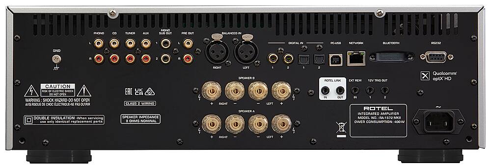The text on the image reads: "PHONO 8 TUNER AUX MONO SUB OUT PRE OUT BALANCED IN POST USH L L DIGITAL IN PC-USB NETWORK BLUETOOTH sEEOR GND R 2 A CAUTION RISK OF ELECTRIC SHOCK DO NOT OPEN WARNING SHOCK HAZARD-DO NOT OPEN AVIS-RISQUE DE DE CHOC ELECTRIQUE-NE PAS OUVRR DOUBLE INSULATION When servicing use only identical replacement parts UK CA CLASS 2 WIRING SPEAKER IMPEDANCE 0 OHMS NOMINAL RIGHT + RIGHT LEFT SPEAKER E SPEAKER A 1 LEFT 2 1 2 ROTEL LINK IN OUT EXT REM 12V TRIG OUT IN 1 2 ROTEL INTEGRATED AMPLIFIER MODEL NO. RA-1572 MKI POWER CONSUMPTION: 400 W Qualcomm X aptXHD I + RIGHT LEFT."