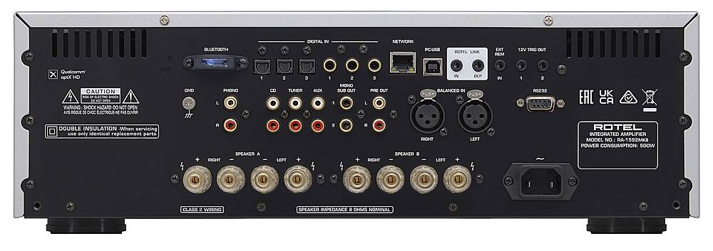 The text on the image reads:

"X BLUETOOTH DIGITAL IN NETWORK POUSB ROTEL LINK EXT REM 12V TIRIC OUT CSR Qualcomm x aptx HD CAUTION 1 - OF ELECTRIC SHOCK I - NOT DRN WARNING SHOCK HAZARD-DO NO NOT OPEN AVS.RSQUE DE CHOC ELECTRIOUE-N PAS OUVRUR DOUBLE INSULATION -When servicing use only identical replacement parts GND TIT 1 PHONO L A SPEAKER RIGHT - 2 3 CD TUNER LEFT AUX 1 2 MONO SUB OUT 1 2 + IN DUT 3 PRE OUT BALANCED IN PUSX PUSM L R RIGHT LEFT SPEAKER . RIGHT LEFT + IN 1 2 RS232 UK EAC CA ROTEL INTEGRATED AMPLIFIER MODEL NO.: RA-1592MKE POWER CONSUMPTION: 500W 18 1 1 I u u I 1 CLASS 2 WIRING SPEAKER IMPEDANCE 8 OHMS NOMINAL"

Corrected text:

"X BLUETOOTH DIGITAL IN NETWORK POUSB ROTEL LINK EXT REM 12V TIRIC OUT CSR Qualcomm x aptx HD CAUTION 1 - OF ELECTRIC SHOCK I - NOT DRN WARNING SHOCK HAZARD-DO NOT OPEN AVS.RSQUE DE CHOC ELECTRIOUE-N PAS OUVRUR DOUBLE INSULATION -When servicing use only identical replacement parts GND TIT 1 PHONO L A SPEAKER RIGHT - 2 3 CD TUNER LEFT AUX 1 2 MONO SUB OUT 1 2 + IN DUT 3 PRE OUT BALANCED IN PUSX PUSM L R RIGHT LEFT SPEAKER . RIGHT LEFT + IN 1 2 RS232