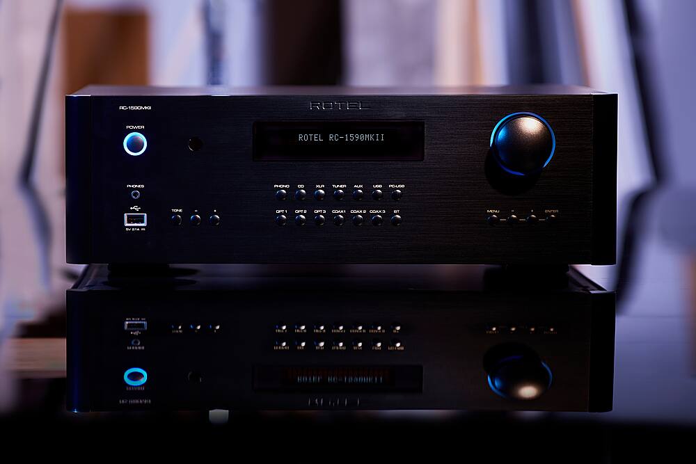 The text on the image reads: "RC-1500M ROTEL POWER ROTEL RC-1590MKII FONES PHONO MIN TUNER AL UDD POUSO TOP EBTT 1 OP D OP . COX COARF CDAX META ENTER NE - *u *E HOTEE O A."