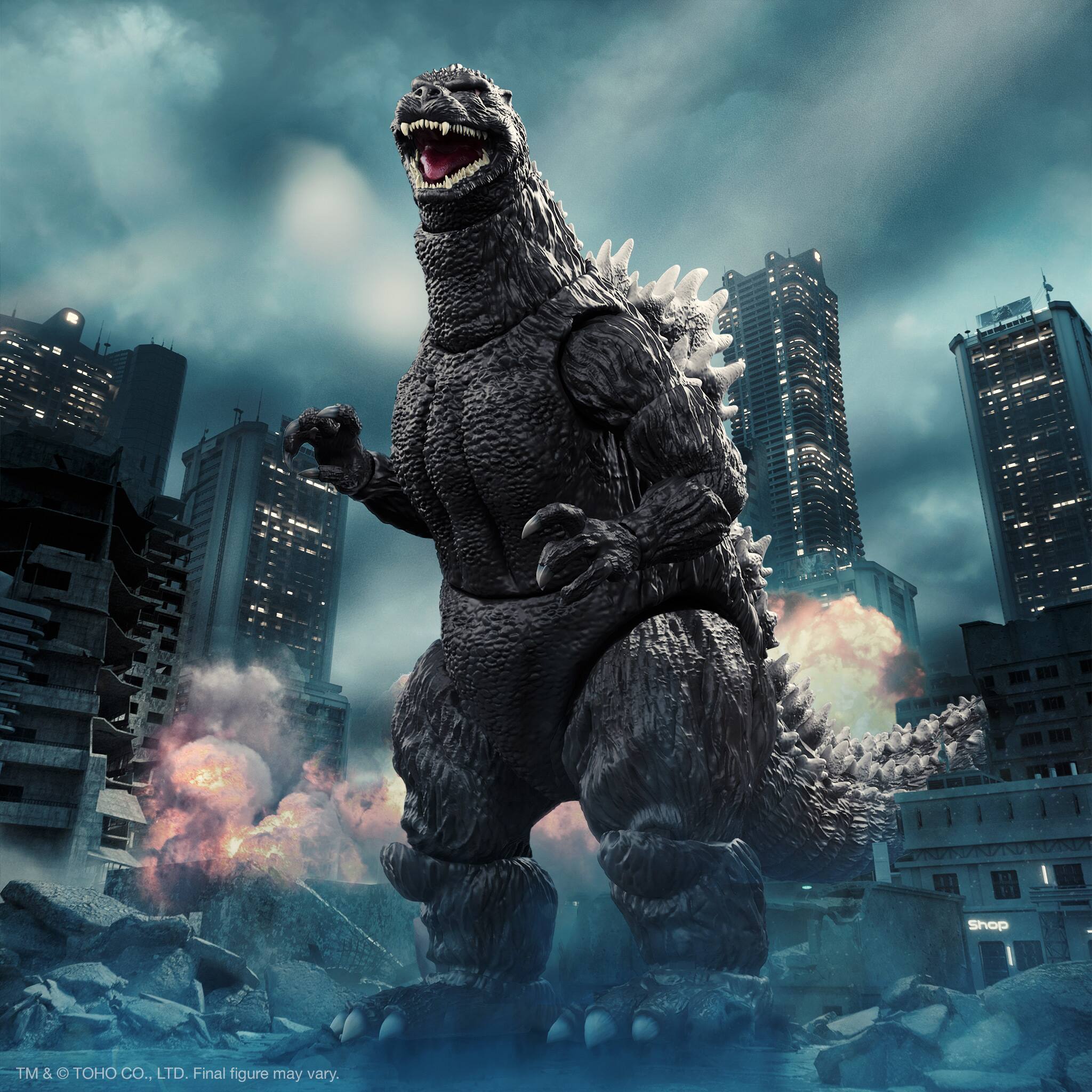 The image features a giant Godzilla action figure standing in a city, with skyscrapers in the background. The action figure is prominently displayed, showcasing its impressive size and detail. The scene captures the excitement and adventure of the action figure, making it an appealing image for fans of Godzilla and action figures alike.