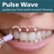 The image shows a woman smiling and holding a water flosser in her mouth. The water flosser is positioned near her teeth, and the image is titled "Pulse Wave guides you from tooth-to-tooth flossing." The image emphasizes the benefits of using a water flosser for maintaining oral hygiene, as it provides a more efficient and effective way of cleaning teeth compared to traditional toothbrushes and floss.