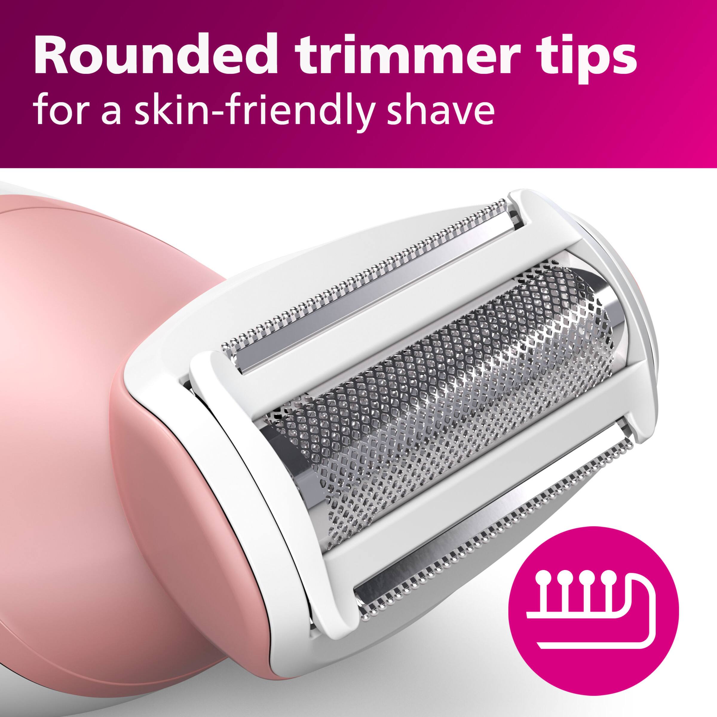 The image features a pink electric shaver with a close-up view of its trimmer tips. The shaver has a rounded design that allows for a skin-friendly shave, making it suitable for sensitive skin. The shaver's design and features are likely intended to provide a comfortable and precise shaving experience.