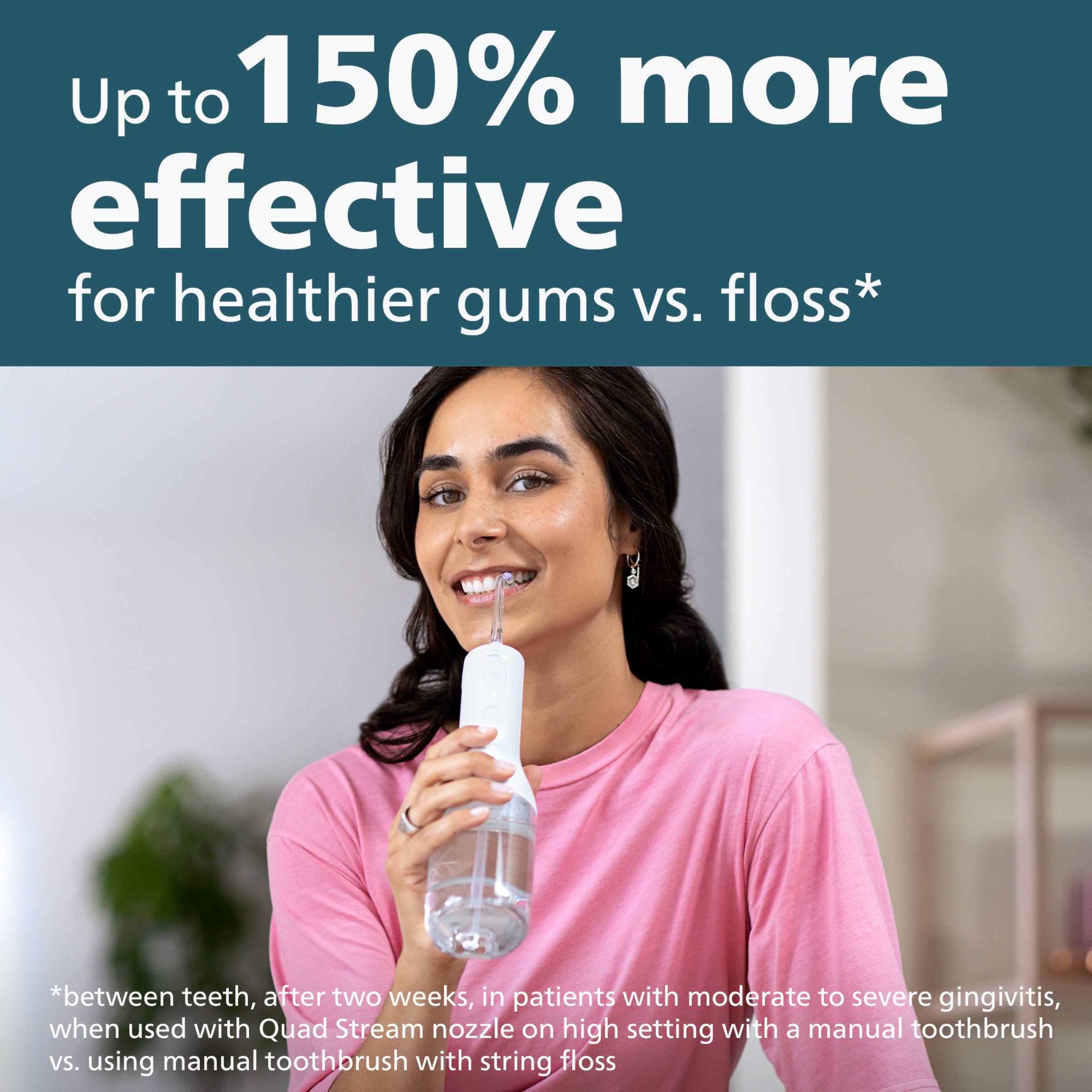 The image features a woman wearing a pink shirt, brushing her teeth with an electric toothbrush. The image is promoting a water flosser, claiming that it is up to 150% more effective for healthier gums compared to traditional floss. The water flosser is being advertised as a better option for maintaining oral hygiene, as it can be used with a Quad Stream nozzle on a high setting with a manual toothbrush, or as a standalone tool.