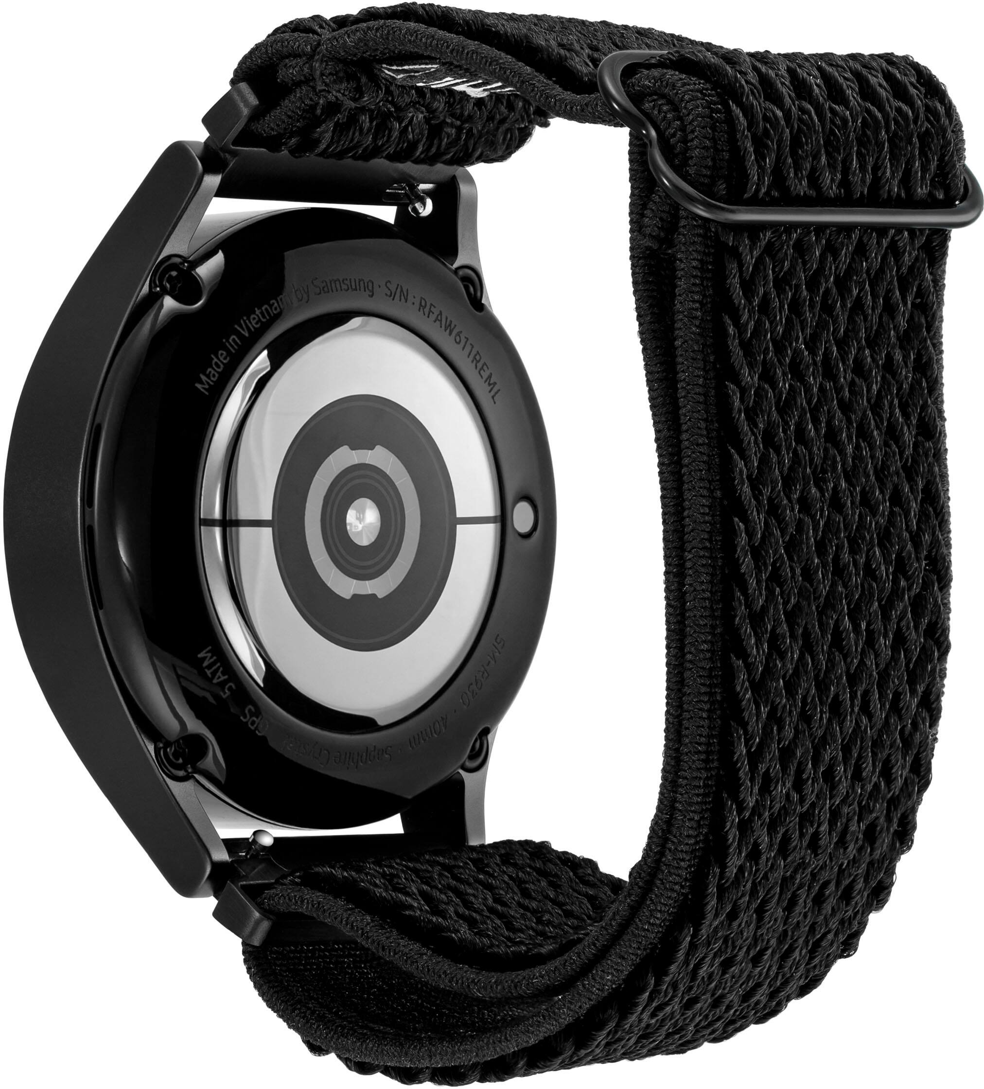 The watch is made by Samsung and has a black face with a silver ring around the center. The watch is waterproof and has a strap made of black nylon. The watch is designed for use in Vietnam and is marked with the RFAW logo. The watch is also marked with the serial number Vietnanby RFAW in RFAW6T1REML.