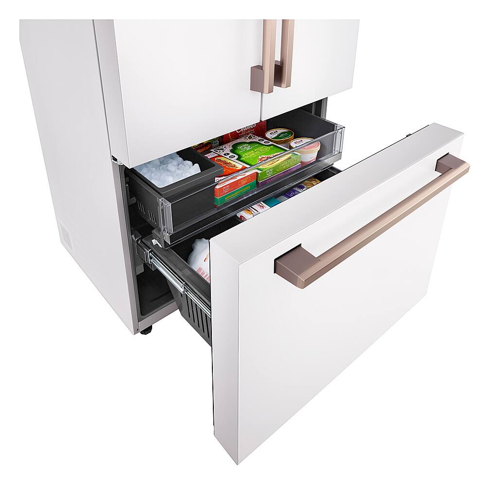 The full size refrigerator has a drawer that is open.