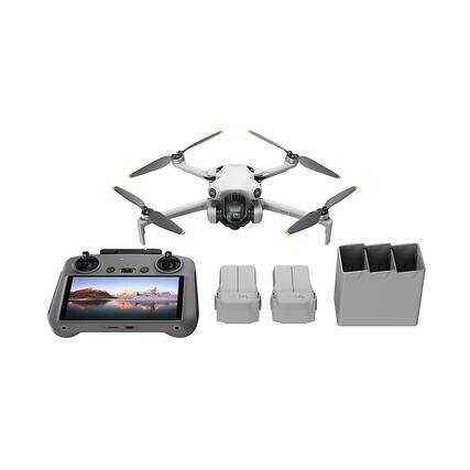 The image shows a drone and its controller, with the drone being the main focus. The drone is positioned above the controller, which is placed on a table. The controller is designed to be used with the drone, allowing the user to control its movements and flight. The drone and controller are likely used for recreational or professional purposes, such as aerial photography or surveying.