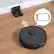 The image features a robotic vacuum cleaner, specifically a Cufy CLEAM 4090PAR2, sitting on a wooden floor. The vacuum is connected to a charging station, which is located next to it. The charging station is an essential part of the robotic vacuum's functionality, as it allows the device to recharge its battery when needed. The image also includes a battery icon, indicating the vacuum's current battery status.