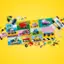 The image showcases a variety of toy cars and trucks, including a pink car and a yellow truck. The toys are scattered around a yellow background, which could be a part of a colorful puzzle or a play area. The scene also features a pile of Legos, indicating that the toys are likely meant for building and creative play. The presence of these toys and Legos suggests that the image is related to the category of Blocks and Building Sets.