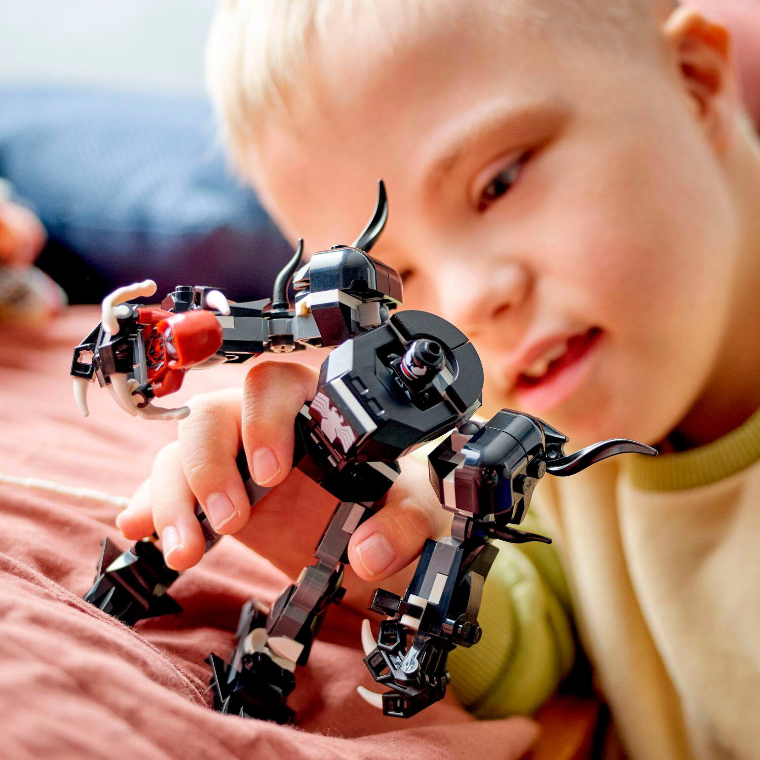 Left. LEGO - Marvel Venom Mech Armor vs. Miles Morales, 76276.