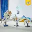 The image features a table with three white toy spaceships, likely from a building set. The toys are arranged in a row, with one on the left, one in the middle, and one on the right. The table is white, and the toys are placed on stands, making them stand out prominently. The scene suggests that the toys are being displayed or played with, possibly by a child or a collector.