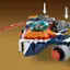 The image features a small toy space shuttle made out of Legos. The shuttle is designed with a cockpit and a landing gear, and it appears to be a space fighter. The toy is displayed on a table, showcasing its intricate design and attention to detail.