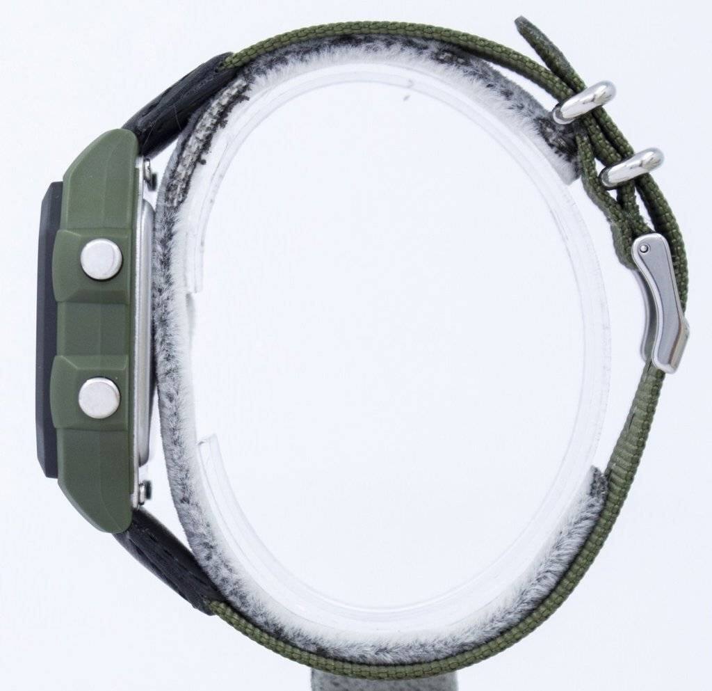 Left. Casio - Illuminator Digital AE-1200WHB-3BV Mens Watch World Time Alarm Stopwatch Timer 100M - Olive Green and Black.