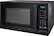 The image shows a black Insignia microwave with a digital clock on the front. The clock displays the time as 10:24. The microwave is a compact and efficient appliance, perfect for small kitchens or dorm rooms. It has various functions such as defrost, cook, and timer, making it a versatile addition to any kitchen. The microwave also has a popcorn, potato, pizza, frozen vegetable, and beverage settings, as well as a dinner plate setting. The digital display and buttons make it easy to use and navigate through the different functions.