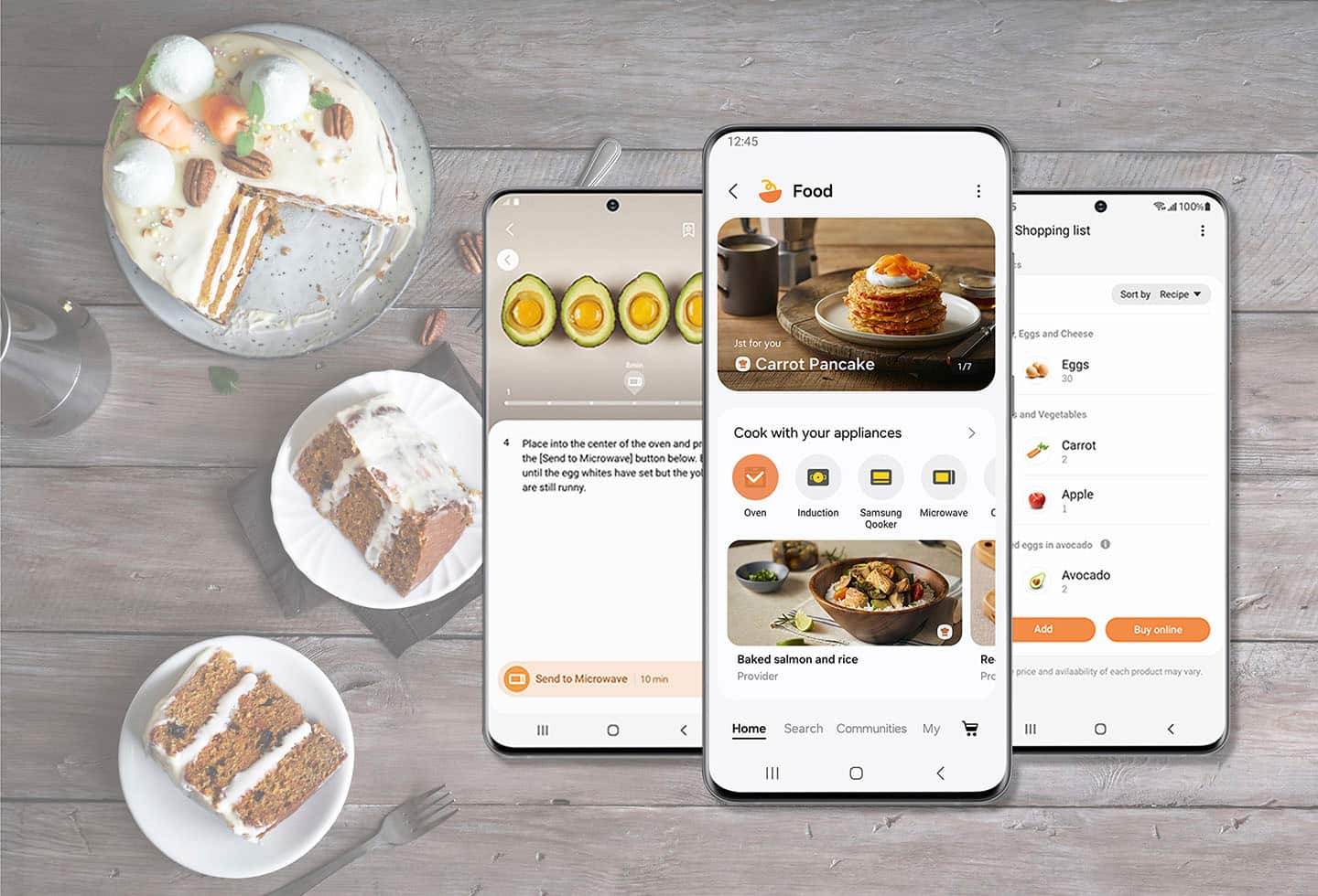 The image shows a table with a variety of food items, including cake, pancakes, and a bowl of food. There are also three cell phones placed on the table, each displaying different food-related apps. The largest text on the table reads "Food." The table is set with a fork and a knife, indicating that it is ready for a meal. The image suggests that the cell phones are being used to access recipes or shopping lists for the meal being prepared.