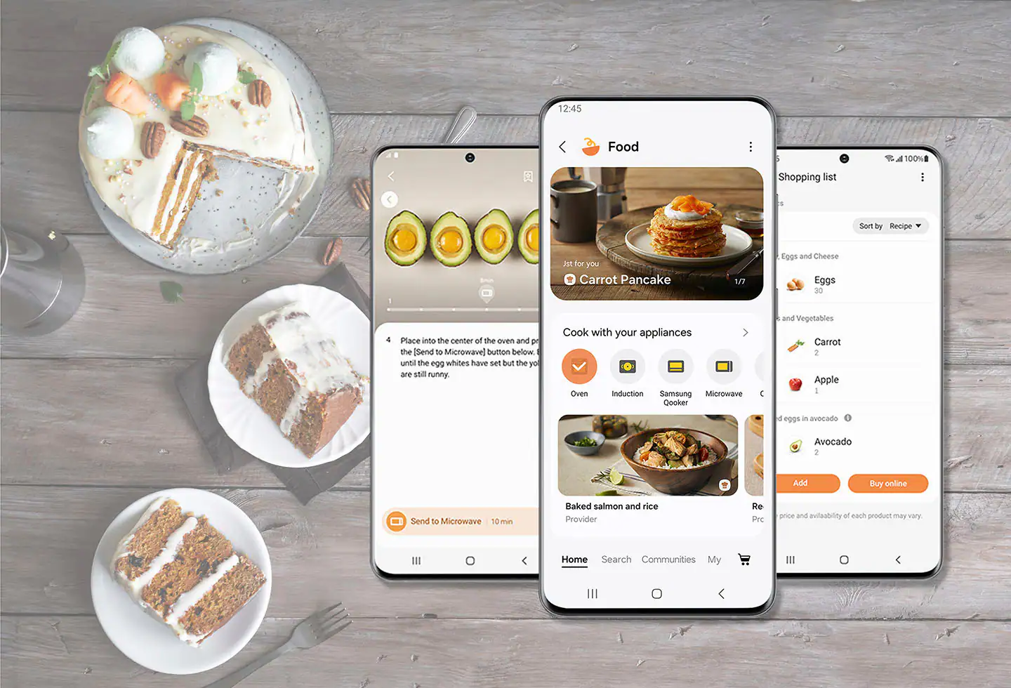 The image shows a table with a variety of food items, including cake, pancakes, and a bowl of food. There are also three cell phones placed on the table, each displaying different food-related apps. The largest text on the table reads "Food." The table is set with a fork and a knife, indicating that it is ready for a meal. The image suggests that the cell phones are being used to access recipes or shopping lists for the meal being prepared.