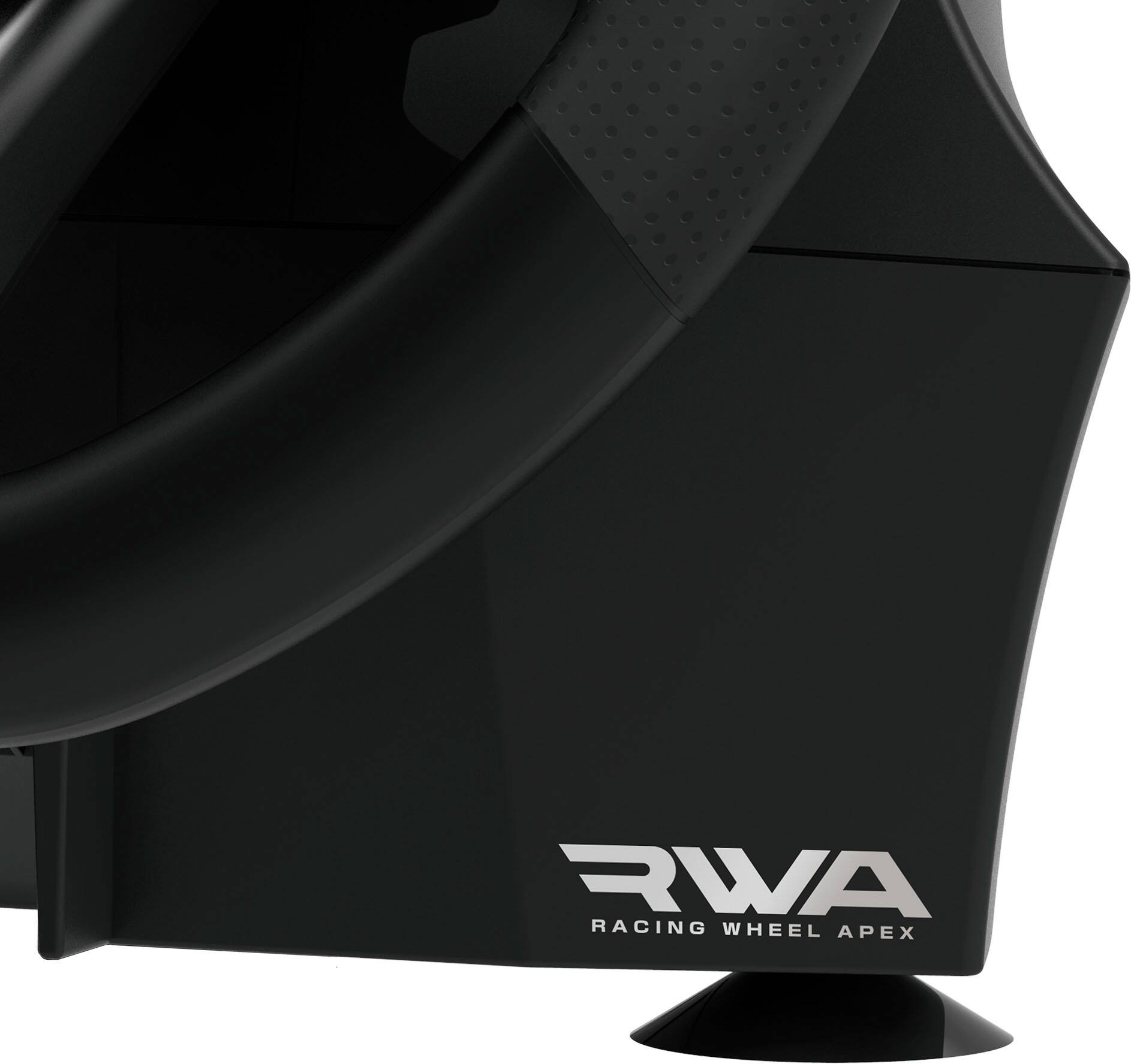 The image features a black steering wheel, which is likely a racing wheel, as it is described as a "RWA Racing Wheel Apex." The wheel is positioned in the foreground, with a black background behind it. The wheel is designed to be used with a computer, and it appears to be a high-quality, specialized racing wheel.