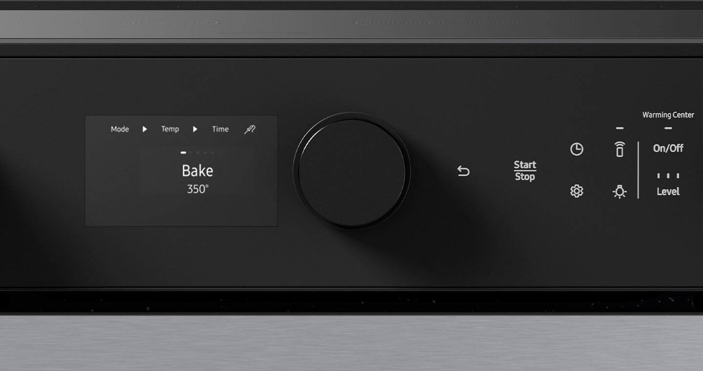The image shows a black oven with a digital display. The display shows the mode, temperature, time, and warming center settings. The mode is set to "Bake," and the temperature is set to 350 degrees. The time and warming center settings are not visible in the image. The oven has a knob to control the settings, and the display is located on the front of the oven.