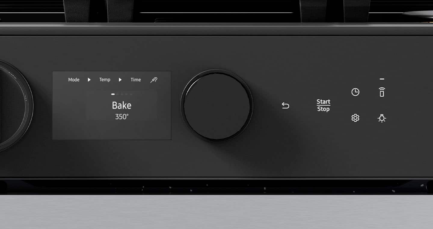 The image shows a black electronic device with a display screen that reads "Bake 350." The device has a knob on the front, which is likely used to control the temperature and time settings for the baking process. The display also shows the current time, which is essential for accurately timing the baking process.