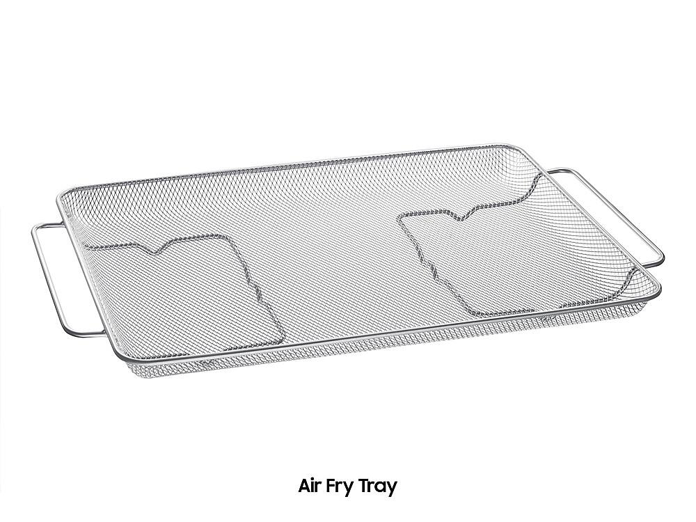 The image shows a close-up view of an air fry tray, which is a type of cooking appliance. The tray is made of plastic and features a mesh design, allowing for even heat distribution during the cooking process. The tray is placed on a white background, making it the main focus of the image. The air fry tray is designed to cook food quickly and evenly, providing a healthier alternative to traditional frying methods.
