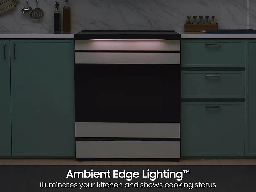 The image features a kitchen with a stove and oven, which is illuminated by ambient edge lighting. The lighting provides a bright and evenly lit environment, making it easier to see and work in the kitchen. The stove and oven are placed under a marble countertop, adding a touch of elegance to the space. The kitchen also has a sink and a few bottles, adding to the overall functionality and aesthetics of the room.