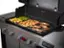 The text on the image reads "welder GENESIS a - - -. - - - - l SEAR ZONE A 350 260 I. HS 104 0o." However, it is not clear what this text is referring to or what it means. It could be a description or instructions related to the grill, but without more context or information, it is difficult to provide a meaningful interpretation.