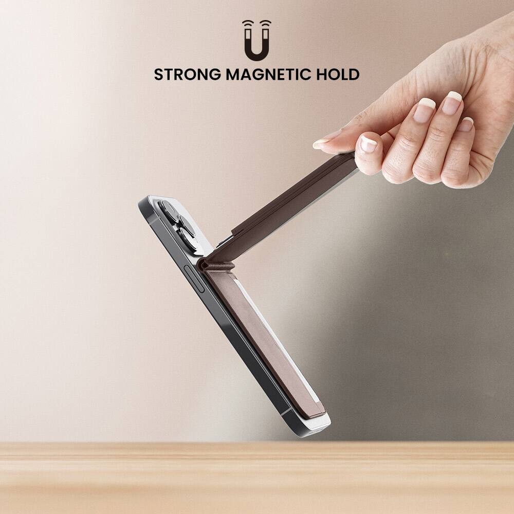 The image features a person holding a wallet or clutch in their hand, with a strong magnetic hold keeping the wallet securely attached to a surface. The wallet is held in front of the person's hand, showcasing the magnetic hold's effectiveness.
