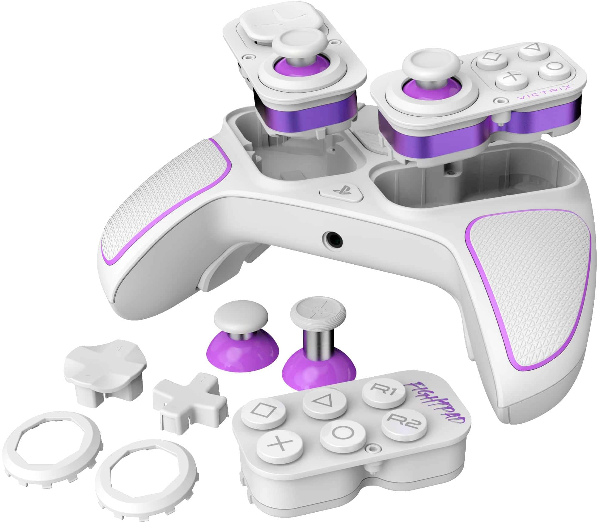The image shows a white and purple video game controller with buttons and a joystick. The controller is designed for use with the PlayStation 3 and features a purple and white color scheme. The buttons are labeled with the letters "V1" and "V2," and the joystick is located in the center of the controller. The controller is shown in a close-up view, highlighting its design and features.