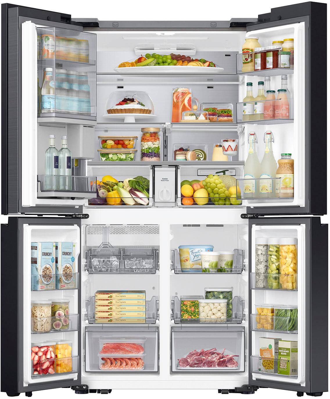 The image features a large, open refrigerator filled with a variety of food items. The refrigerator is stocked with multiple bottles, including water and juice, as well as several fruits such as apples and oranges. There are also multiple sandwiches and a cake inside the fridge. The refrigerator is well-organized and appears to be well-stocked, making it an ideal choice for those who enjoy having a variety of food options at their disposal.