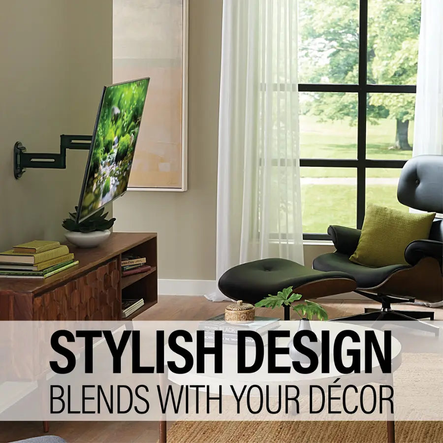 The image showcases a stylish living room with a large flat screen TV mounted on the wall. The room also features a comfortable chair and a couch, providing ample seating options. A potted plant adds a touch of greenery to the space, while a vase with flowers further enhances the room's decor. The room is decorated with books, which can be seen on a shelf or table, and a remote control is placed nearby for easy access to the TV. The overall design of the living room creates a harmonious and inviting atmosphere.