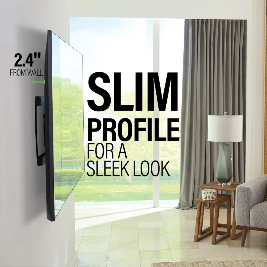 The image showcases a living room with a flat screen TV mounted on the wall. The TV is described as having a slim profile, which adds to the sleek look of the room. The living room also features a couch, a chair, and a lamp, creating a cozy and inviting atmosphere.