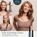 The image features a woman with curly hair, smiling and holding a hair curler. The product is advertised as the "Best for Short & Medium Hair Lengths" and is a 0.95" Auto-Wrap Curlers. These curlers automatically wrap, curl, and set for hassle-free tight curls in seconds.