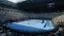 The text on the image reads "AD 990890 - - 00-00.05 MED . DER O PES o AO AO A A  CV Emirates FLY BETTER mirates RETTER Emirates BETTER FLT Emiranes Emirates KA DUNLOP CyberCX Infosys u se  u   K K  KA    A SE Vo Emirates Emicas  VED e faiei  JAA." It appears to be a mix of advertisements and information related to the tennis match taking place.
