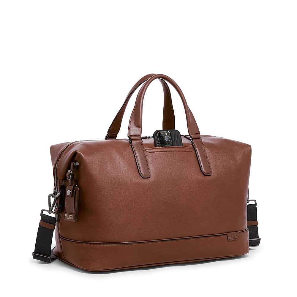 Left View: TUMI - Harrison Nelson 11" Duffel Bag - Cognac