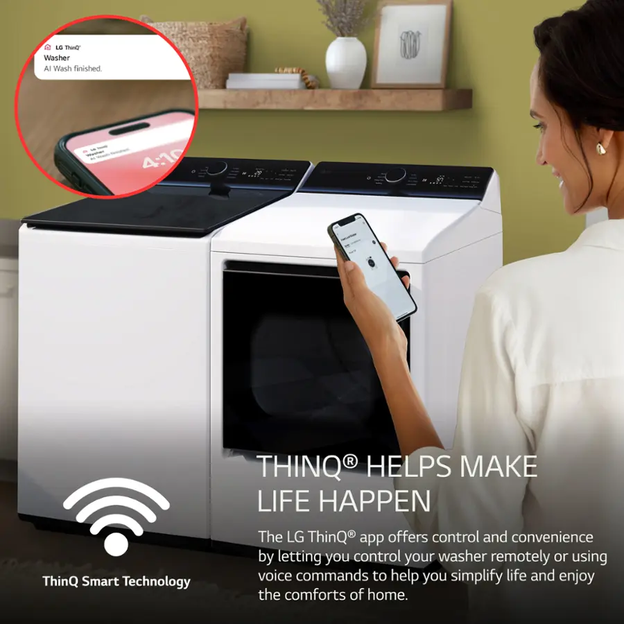 The image features a woman holding a cell phone in front of a washing machine. The woman is likely using the LG ThinQ app to control her washer remotely or using voice commands for added convenience. The app is designed to make life easier and more enjoyable by simplifying tasks around the home. The washing machine is equipped with ThinQ Smart Technology, which enhances its functionality and connectivity.