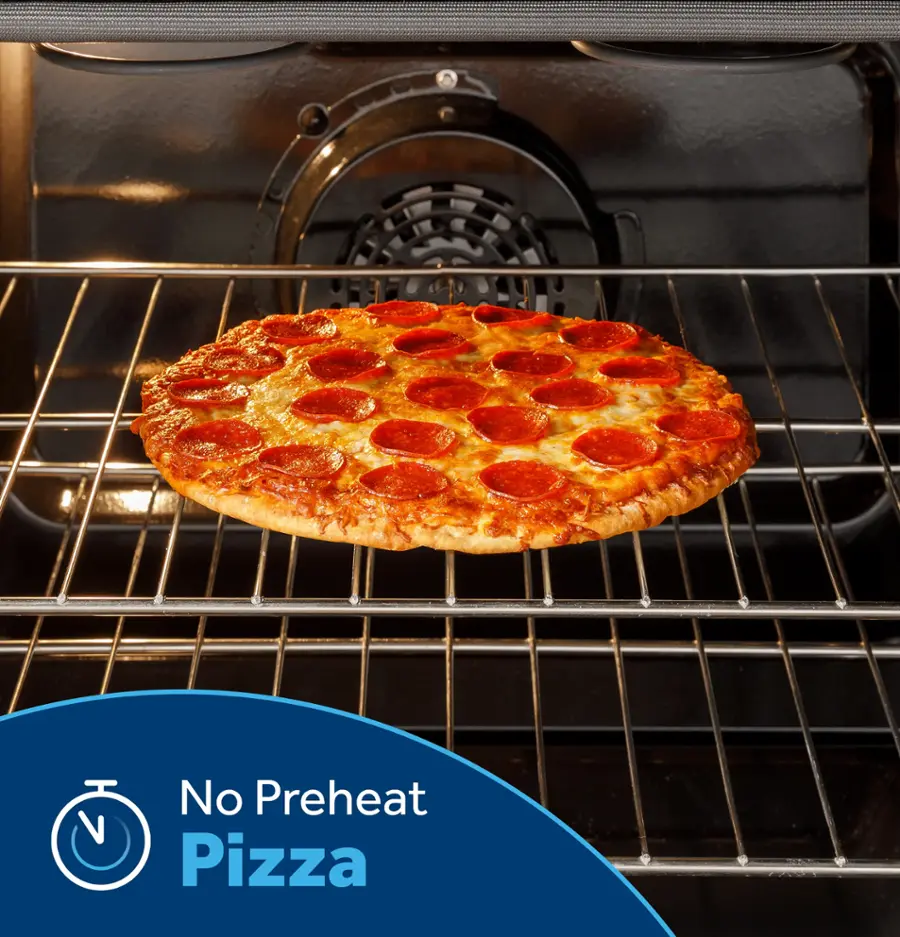 The image features a pepperoni pizza sitting on a rack inside an oven. The pizza is placed on a tray, and the oven is turned off. The pizza is not preheated, as it is being cooked without any preheating. This suggests that the pizza might be cooked using a different method or that the oven is being used for a different purpose.