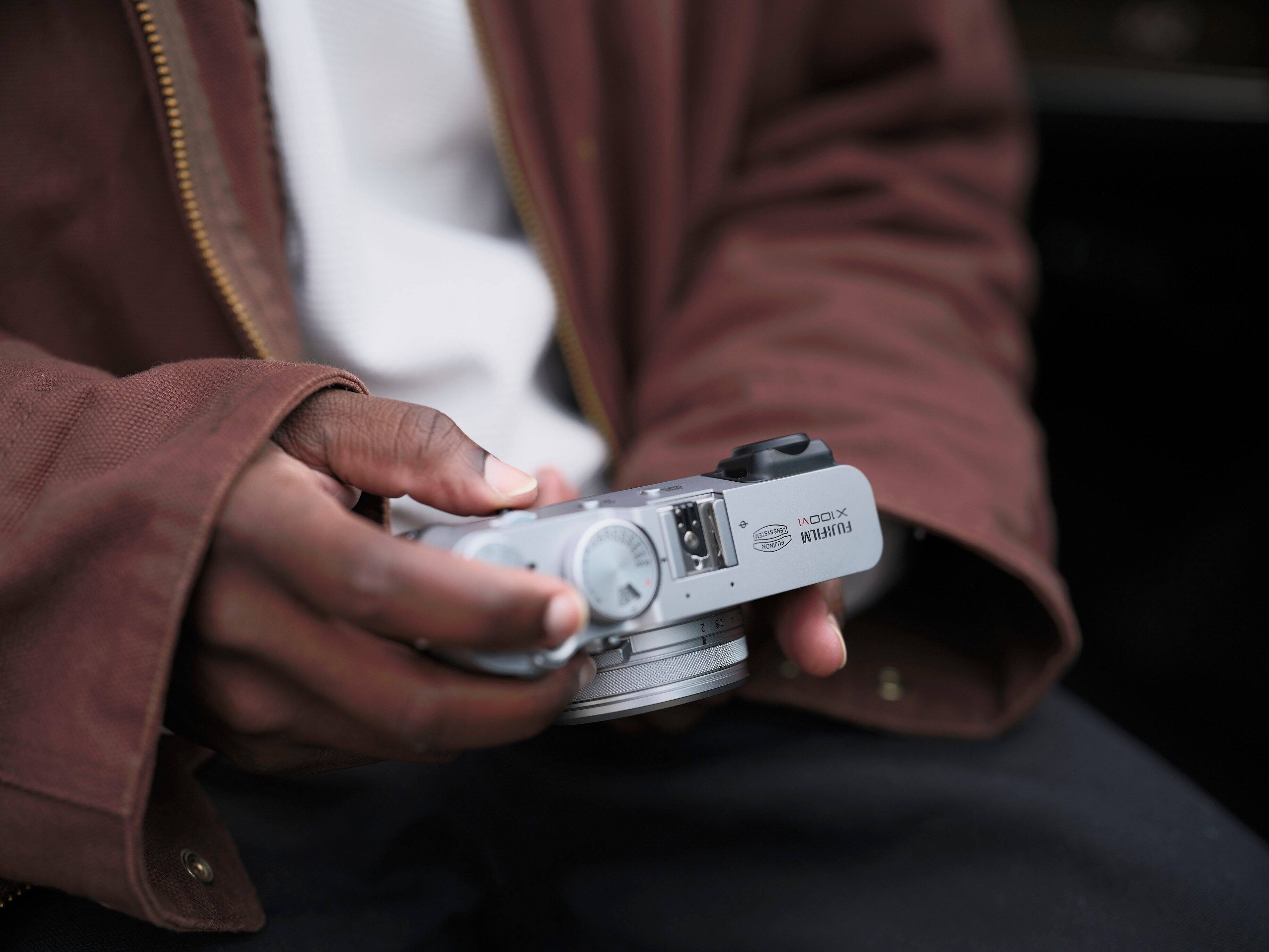 A person is holding a camera in their hand.