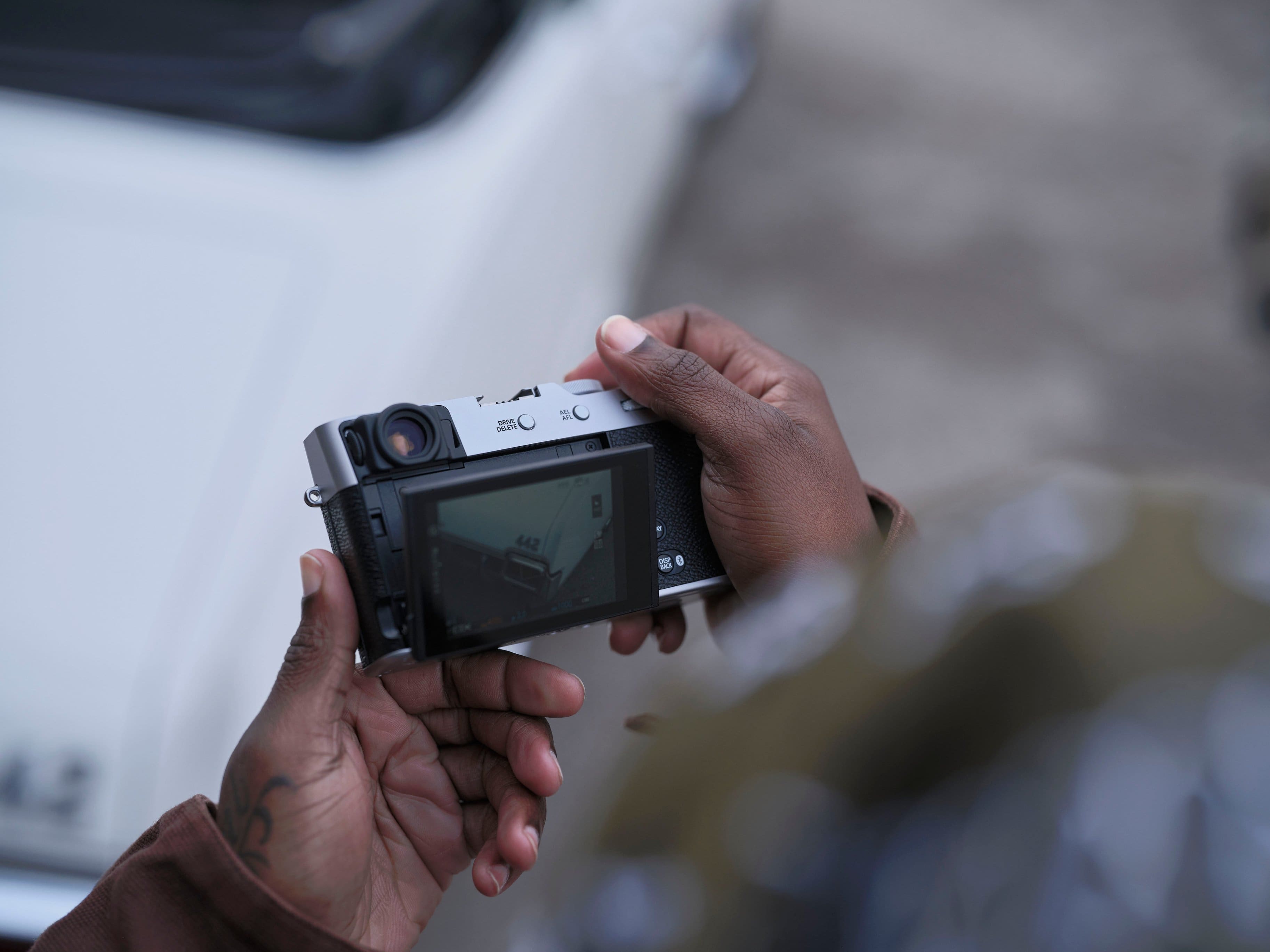 A person is holding a camera in their hand.