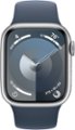 Angle. Apple - Apple Watch Series 9 GPS + Cellular 41mm Aluminum Case with Storm Blue Sport Band  (Small/Medium) - Silver.