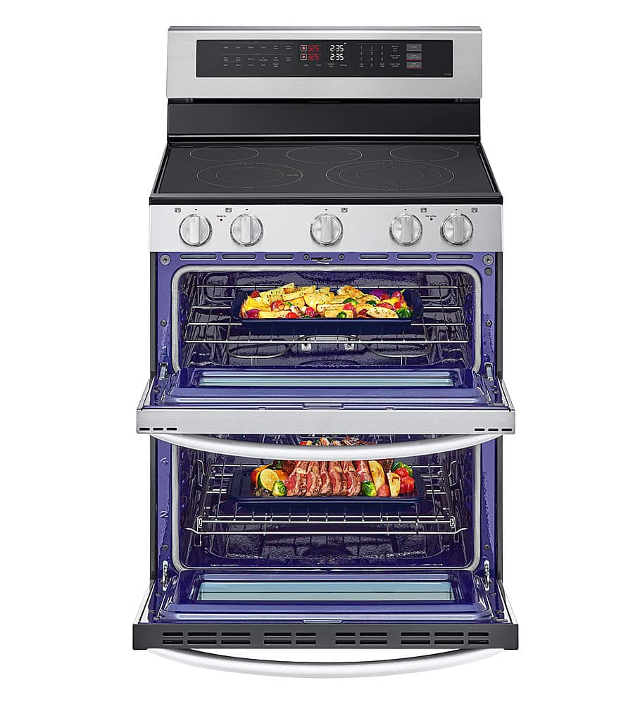 The image features a stainless steel oven with a blue interior, filled with various food items. There are two trays of food inside the oven, one on the top rack and the other on the bottom rack. The oven has a digital display, which shows the time and temperature settings. The oven is open, revealing the delicious meal being cooked inside.